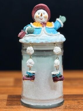 CANDLE-LITE “Holiday Snow” Candle with Dangling Leg Snowman Lid